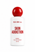 A 50 ml bottle of BA BE LL Skin Addiction Eau de Parfum, featuring a white cylindrical body with bold red text and a glossy red spherical cap, set against a plain white background.