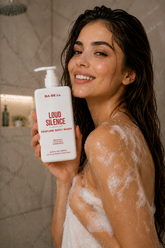 Woman in the shower holding Babell Loud Silence perfume body wash, 250ml.