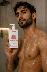Man in the shower holding Babell Loud Silence perfume body wash, 250ml.