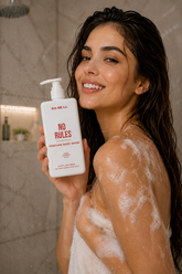 Woman in the shower holding Babell No Rules perfume body wash, 250ml.