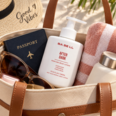 Babell After Dark perfume body lotion 300ml bottle in a travel bag beside a passport and towel