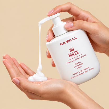 Babell No Rules perfume body lotion pump dispensing white lotion into a palm