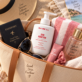 Babell Skin Addiction perfume body lotion 300ml bottle in a travel bag beside a passport and towel
