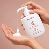 Babell Soft Sin perfume body lotion pump dispensing white lotion into a palm