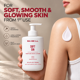 Woman holding Babell Soft Sin perfume body lotion beside a drop of lotion on her shoulder