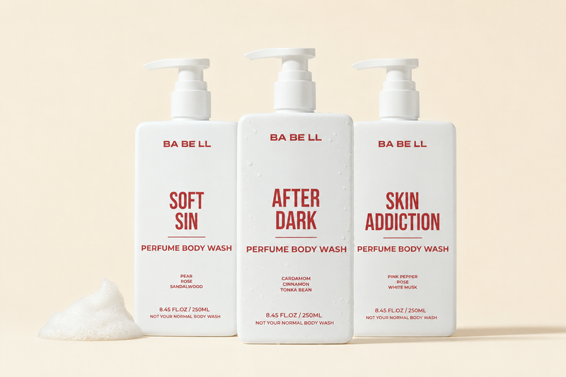Three Babell 250 ml perfume body wash bottles - Soft Sin, After Dark and Skin Addiction - grouped on a cream background