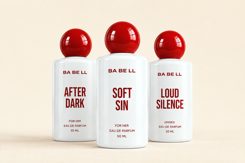 Three Babell 50 ml eau de parfum bottles - After Dark, Soft Sin and Loud Silence - grouped on a cream background